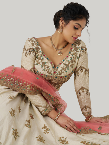 Classic white Zari silk lehenga for timeless bridal elegance