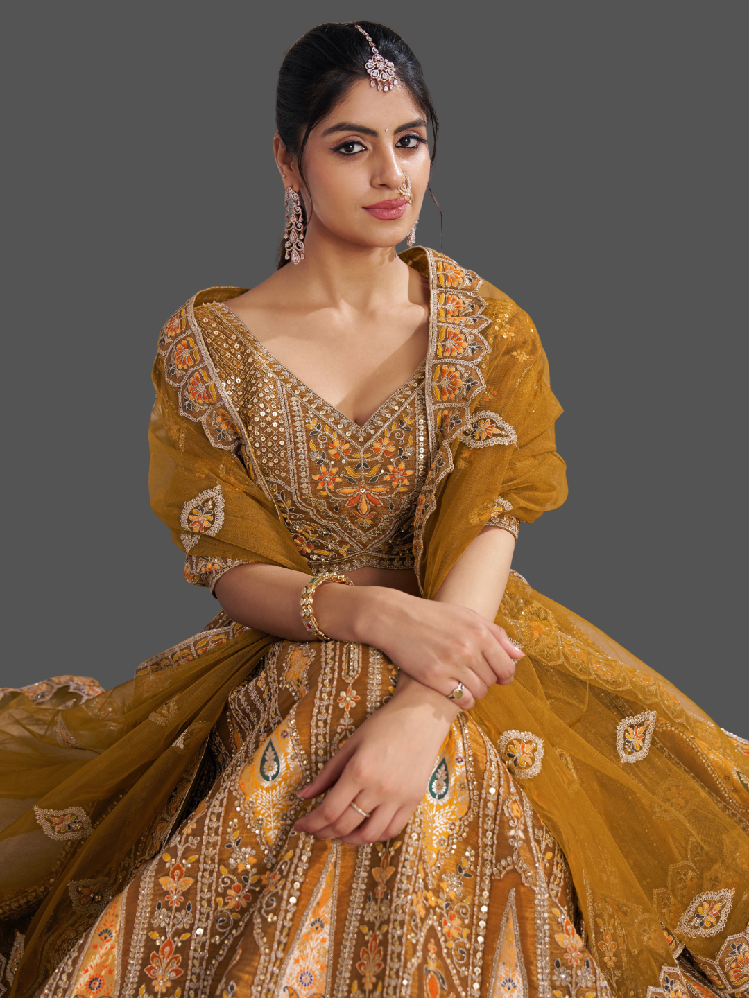 Vibrant mustard lehenga in Banarasi silk for festive flair